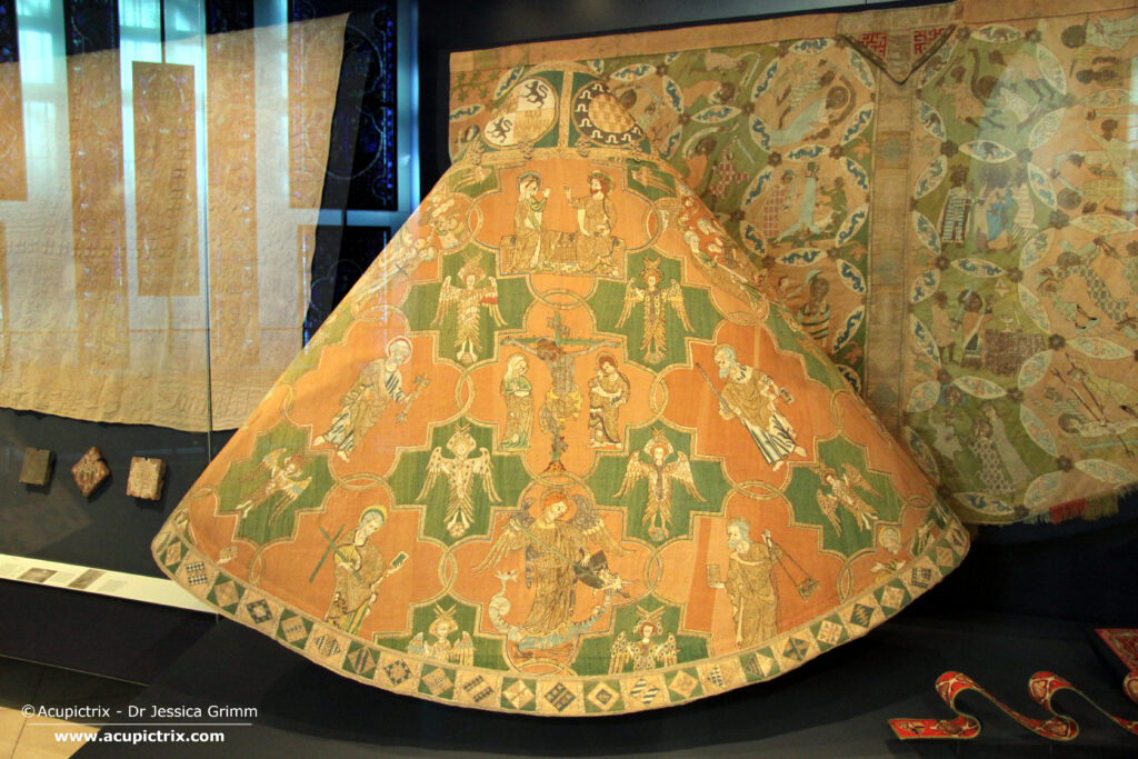 The Syon cope (83-1864) in its display case in the Victoria & Albert Museum, London.