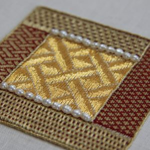 Small embroidered goldwork sampler.