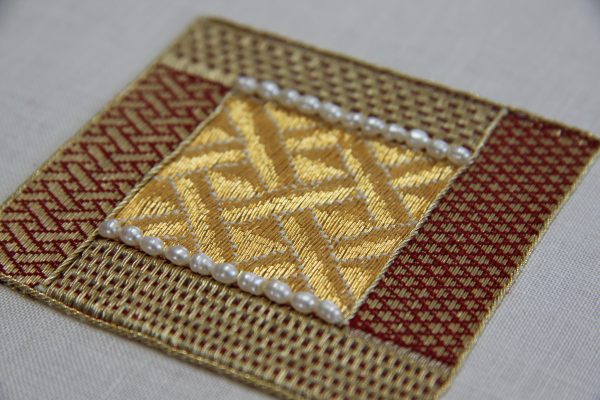 Small embroidered goldwork sampler.