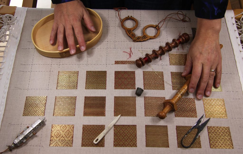 Slate Frame with diaper pattern couching goldwork embroidery and medieval embroidery tools.