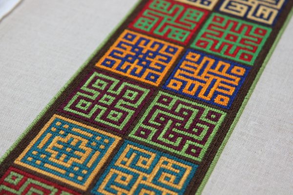 Embroidery sample showing long-armed cross-stitch.