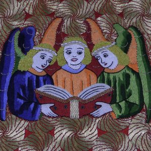 Three colourful embroidered angels singing from a hymnal.