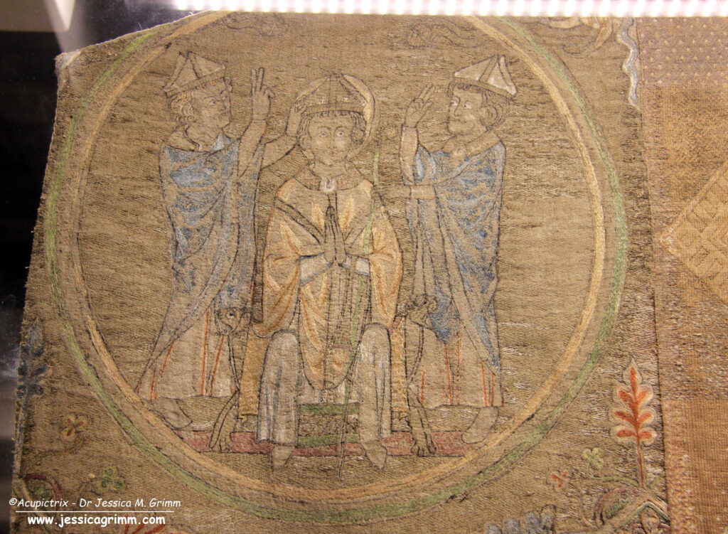 Opus anglicanum embroidery showing St Nicholas being crowned bishop.