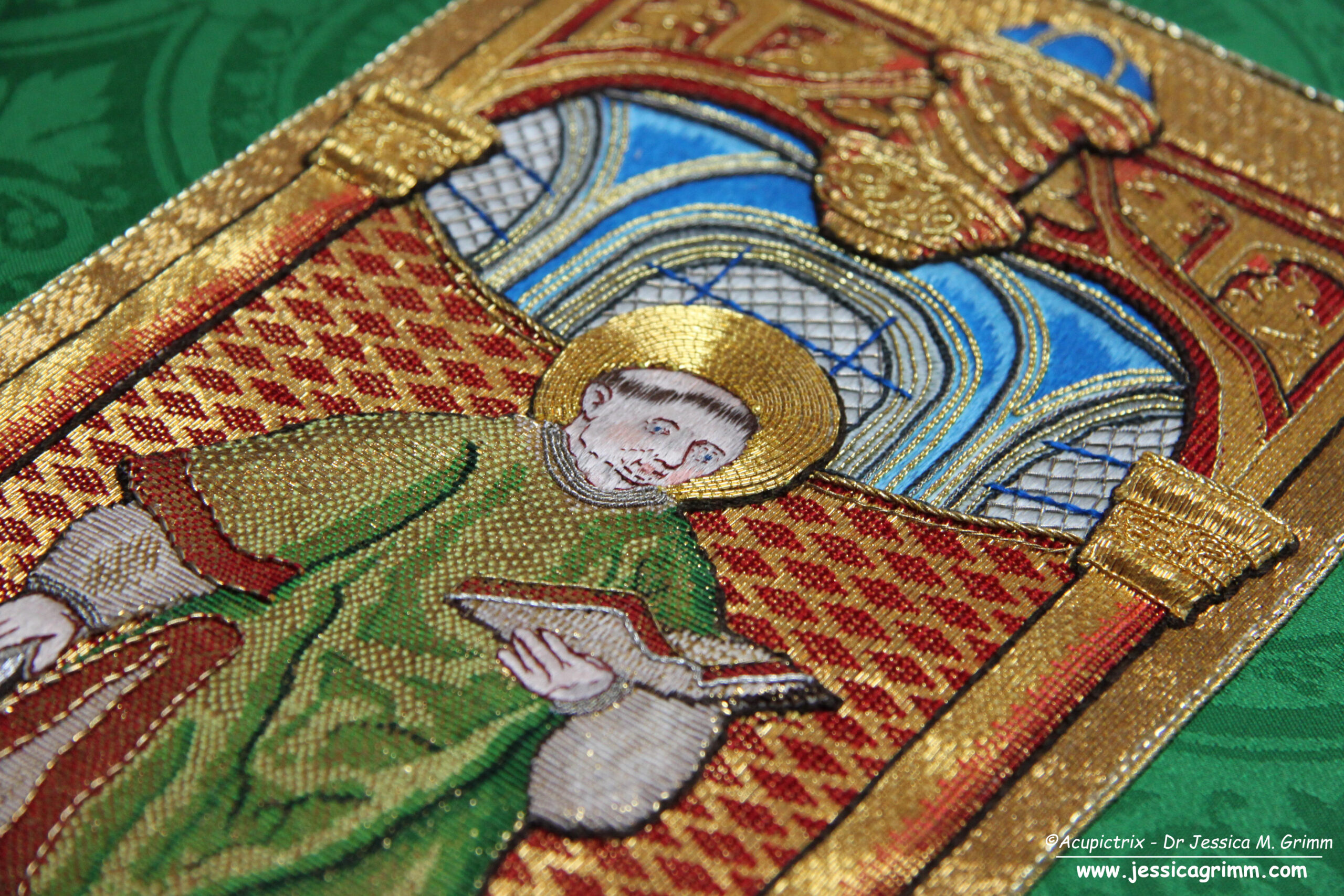 Replicate medieval goldwork embroidery orphrey showing Saint Lawrence