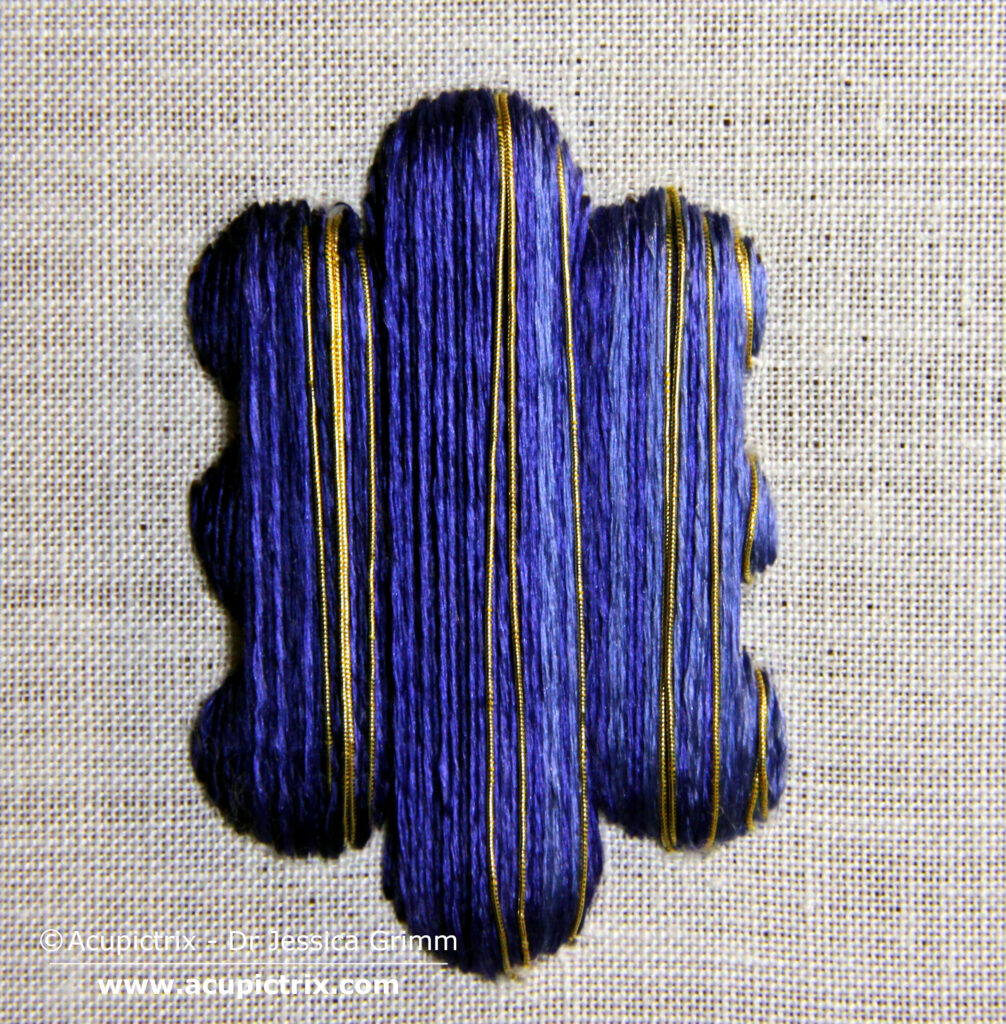 Modern embroiderers would now probably proceed by shading each grape individually. Not so our medieval embroiderer: he did the whole lot in one go! Add shaded satin stitch or laid work on top of the padding. I've used a slightly twisted silk by DeVere Yarns (#60) in three shades of blue. Once all the silk is in, add a few highlights with your gold thread. I've used a #6 passing thread directly in the needle.