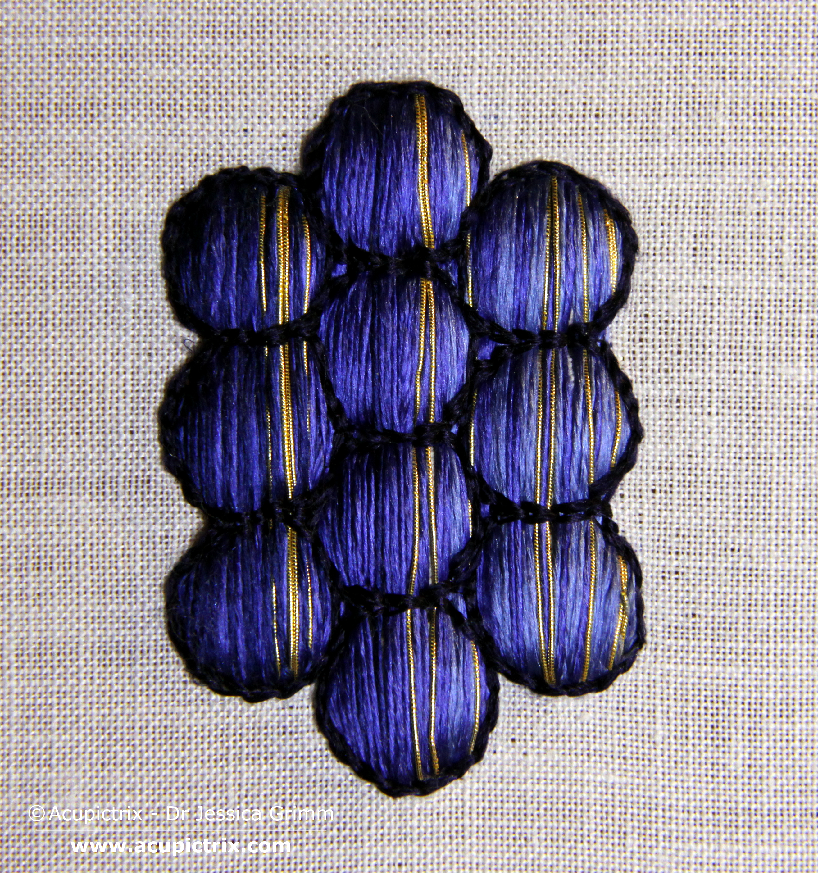 Modern embroiderers would now probably proceed by shading each grape individually. Not so our medieval embroiderer: he did the whole lot in one go! Add shaded satin stitch or laid work on top of the padding. I've used a slightly twisted silk by DeVere Yarns (#60) in three shades of blue. Once all the silk is in, add a few highlights with your gold thread. I've used a #6 passing thread directly in the needle.