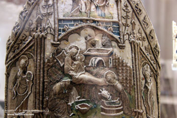 Pearl Embroidery - an embroidered white mitre on display at the museum.