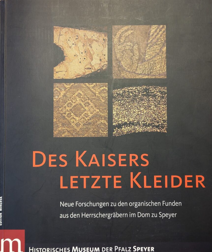 Book review - Black book band with detailed pictures of goldwork embroidery