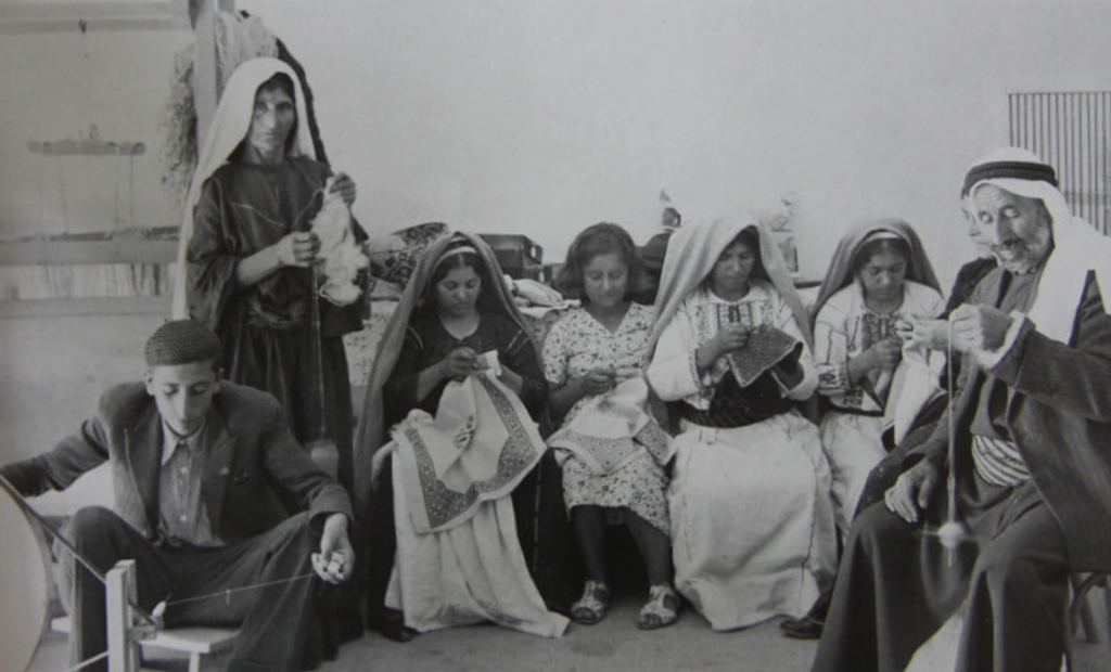 Fallahi embroidery - black and white picture of a group of people embroidering