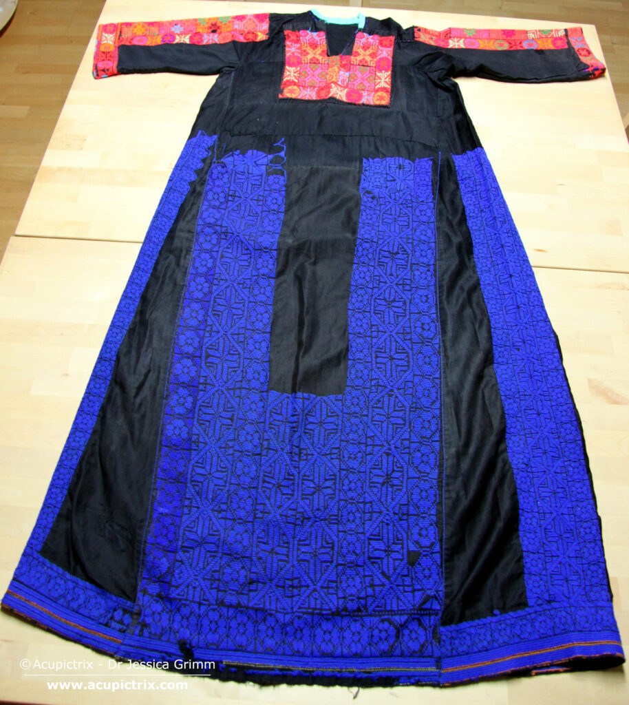 Fallahi embroidery - black Bedouin dress with colourful crossstitch embroidery