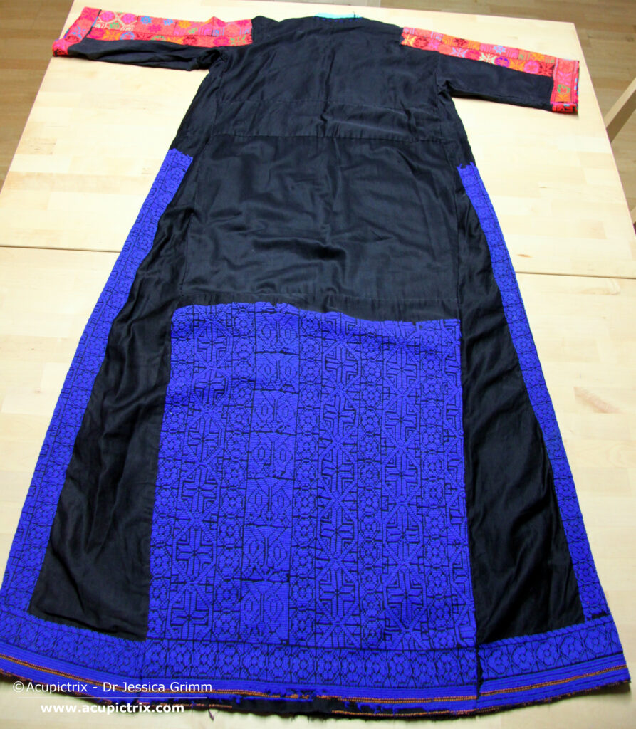 Fallahi embroidery - black Bedouin dress with colourful crossstitch embroidery