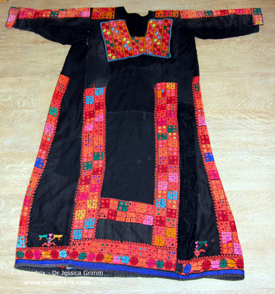 Fallahi embroidery - black Bedouin dress with colourful crossstitch embroidery