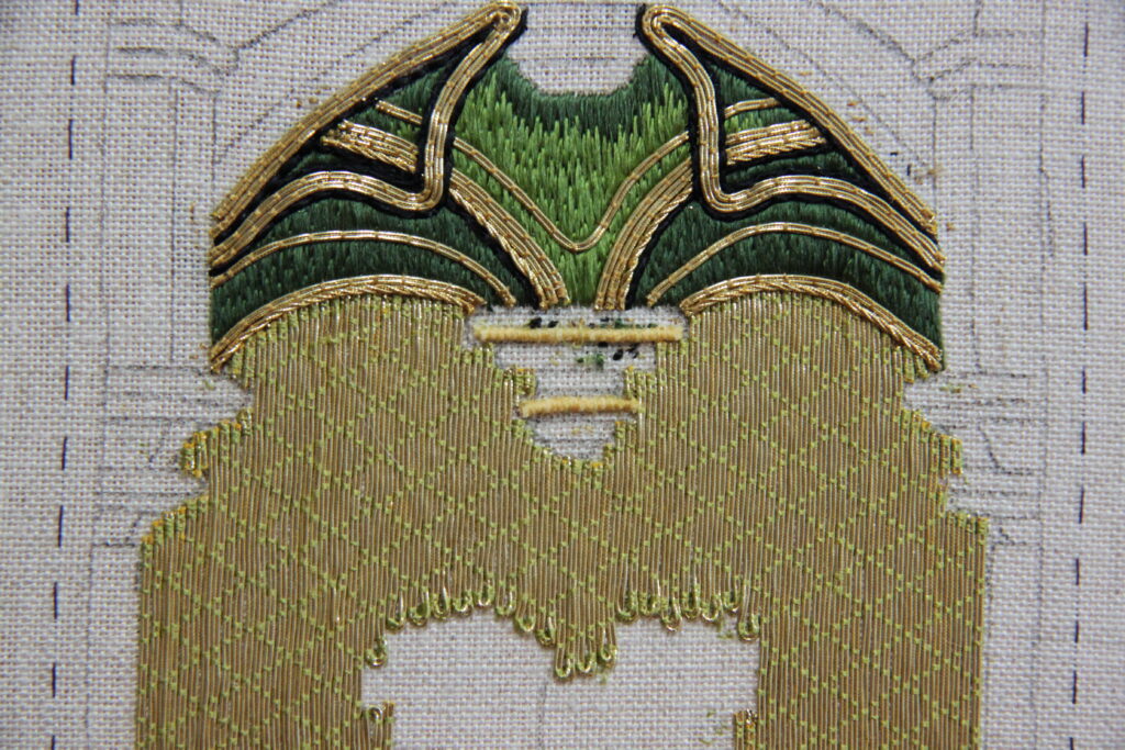 Goldwork Course - an unfinished goldwork embroidery featuring a green vault and a golden background.