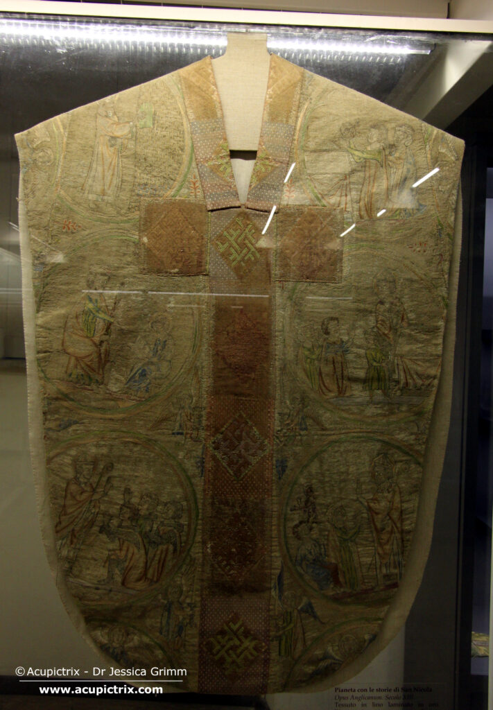 Opus anglicanum - display case with a multi coloured vestment