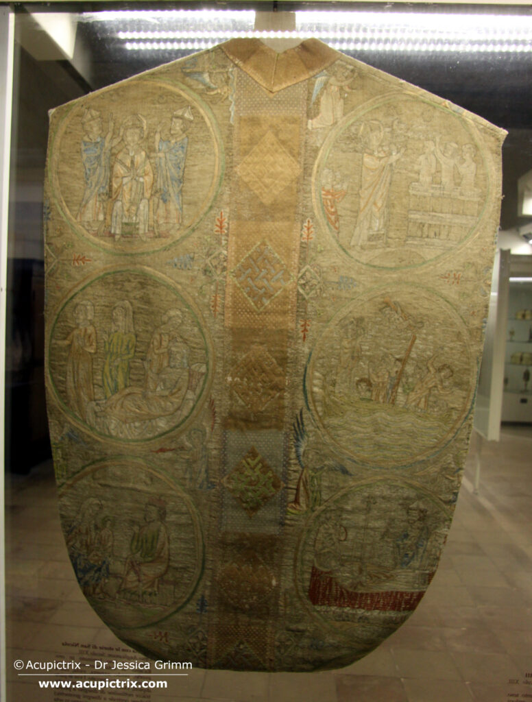 Opus anglicanum - display case with a multi coloured vestment