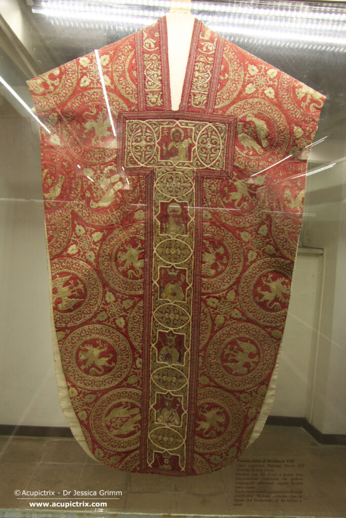 Opus cyprense - red chasuble with goldwork embroidery in a display case