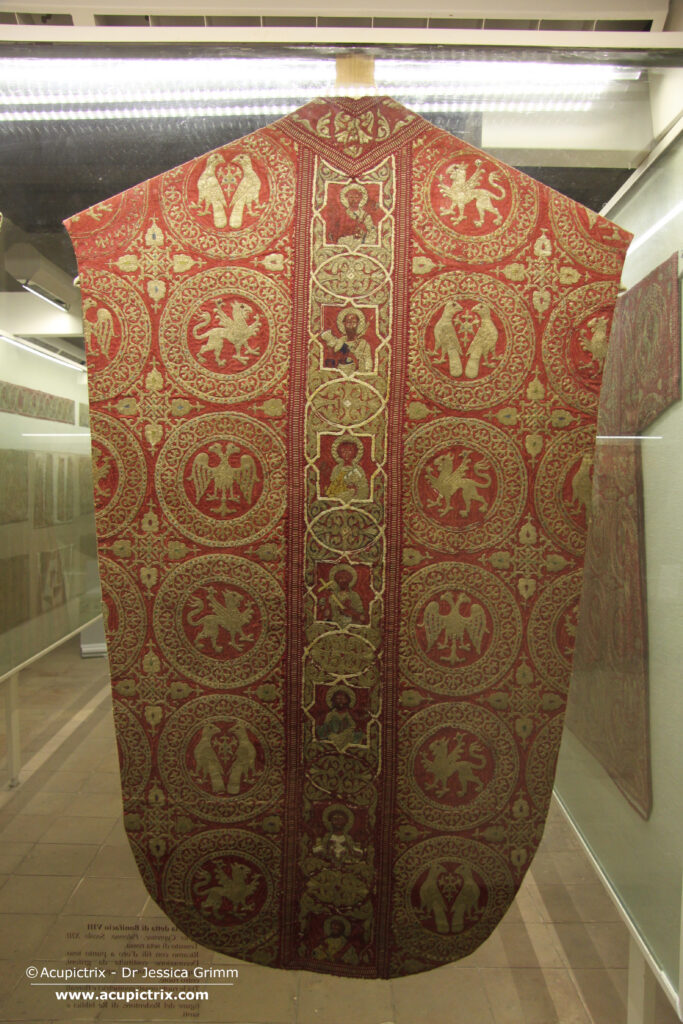Opus cyprense - red chasuble with goldwork embroidery in a display case