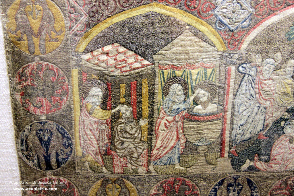 Opus romanum - multi coloured embroidery showing two men 