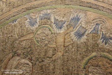 Opus anglicanum - multi coloured embroidery showing an angel with a crown in the clouds